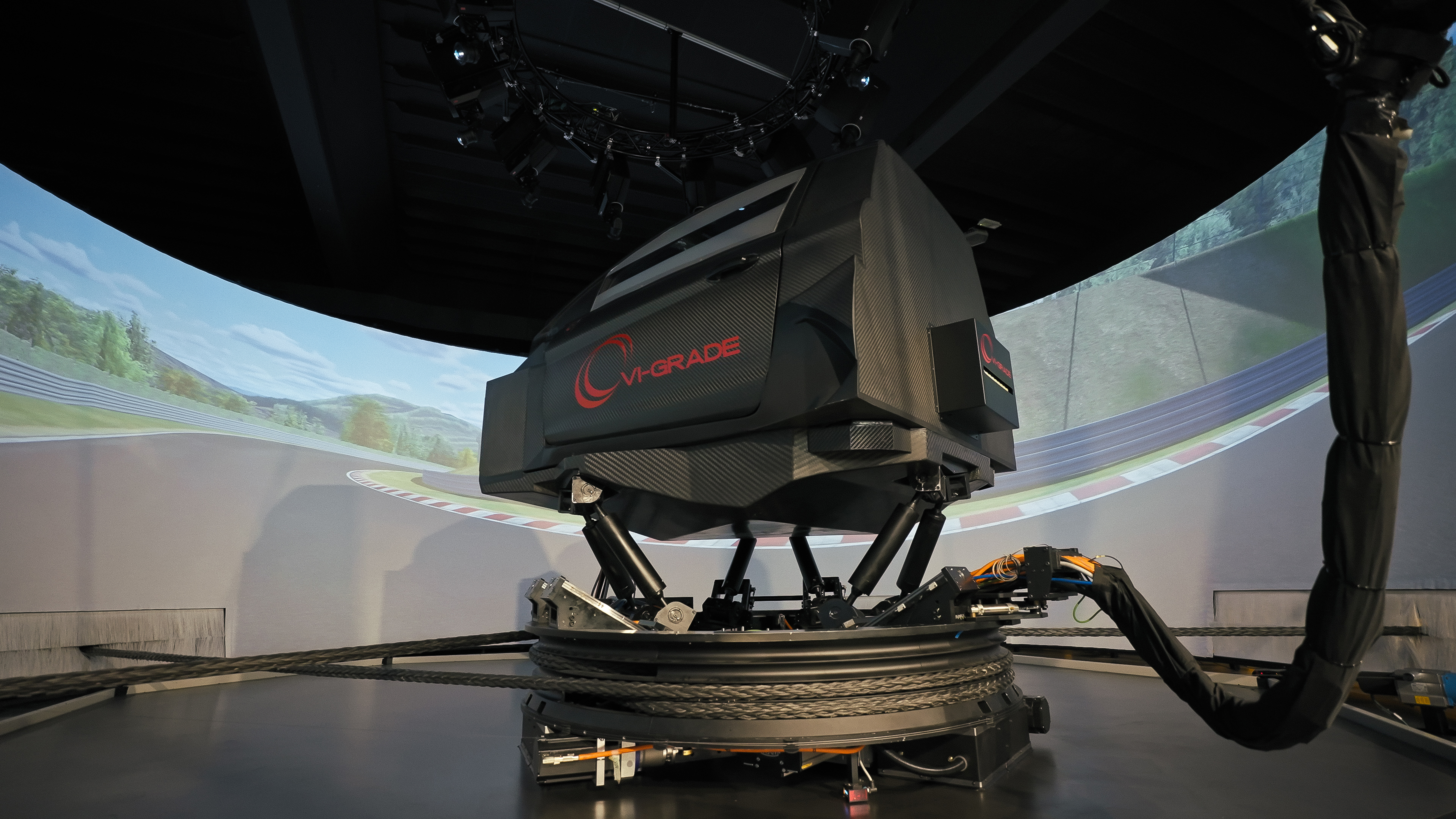 The next step sees the Bugatti team testing the latest results in a full-motion simulator, as shown here with the simulation experts at VI-grade in Italy.